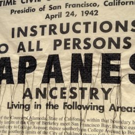 "Instructions to All Persons <br/> of Japanese Ancestry" 2019<br/>Lisa Solomon<br/>Sashiko embroidery on fabric<br/>64 in. x 41 in.