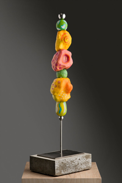 Nina Temple<br/>
"Color on a Stick"<br/>
Acrylic on fired clay, cement, stainless steel, 2019<br/>
in. x in.<br/>
Courtesy of the artist<br/><br/>
Color on a Stick is part of a series I created in 2019. Organic clay fired shapes that are then painted with acrylic and stacked on a stainless steel rod, grounded with a cement base. My approach to form is done in a non-objective intuitive manner, often referred to as “organic abstraction.”